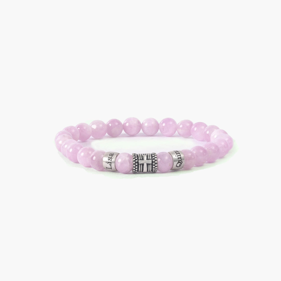 Personalized pink quartz bracelet featuring custom family names and cross charm