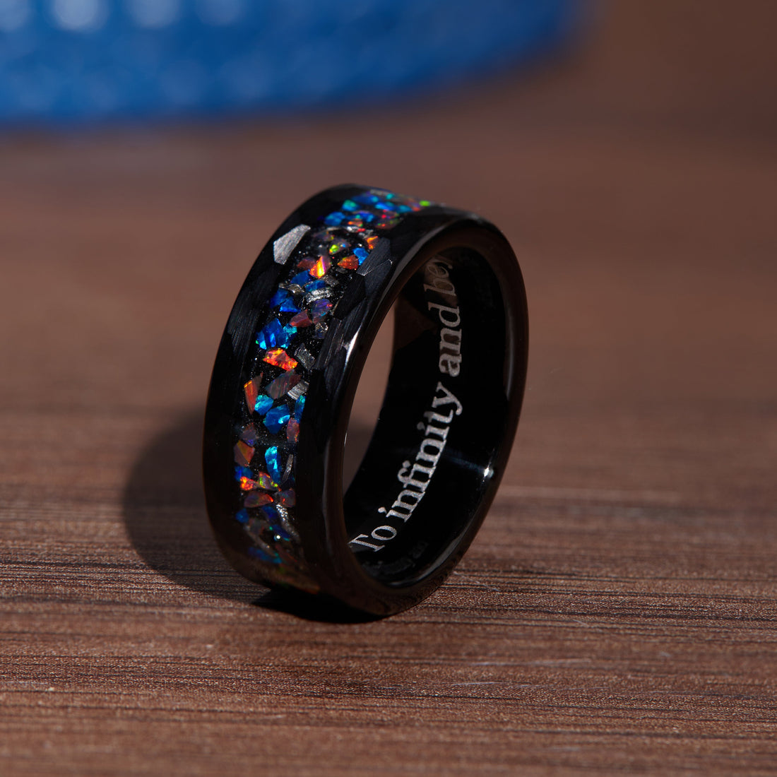 Elegant black ring for men adorned with brilliant opal gemstones for a standout look.