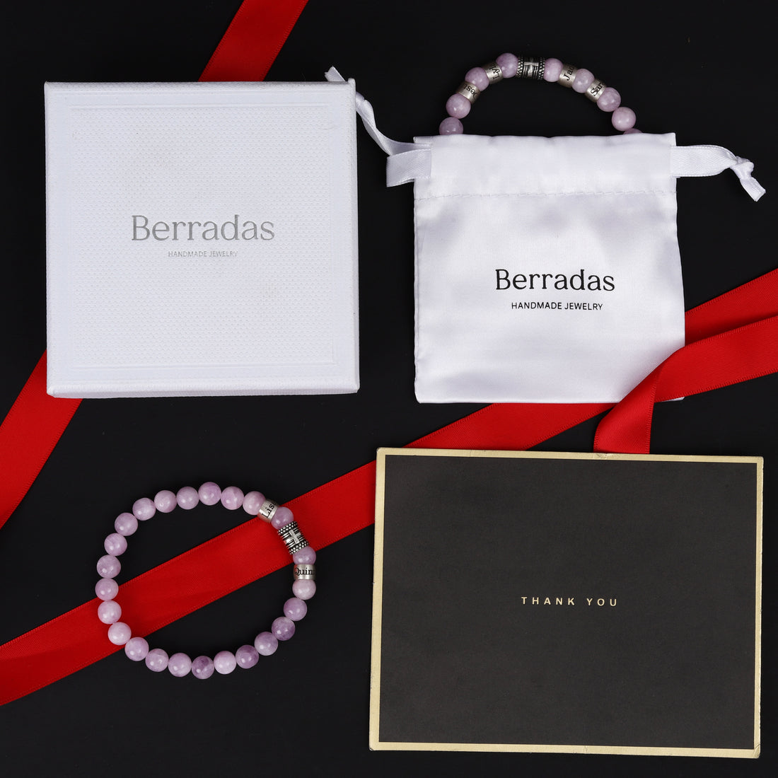 Elegant gift packaging for custom pink quartz bracelet with engraved family names and cross charm