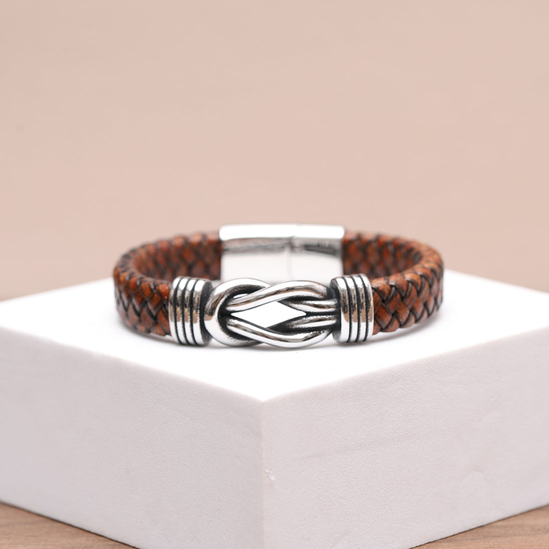 men Sleek brown leather wrap bracelet, designed for a comfortable and snug fit.