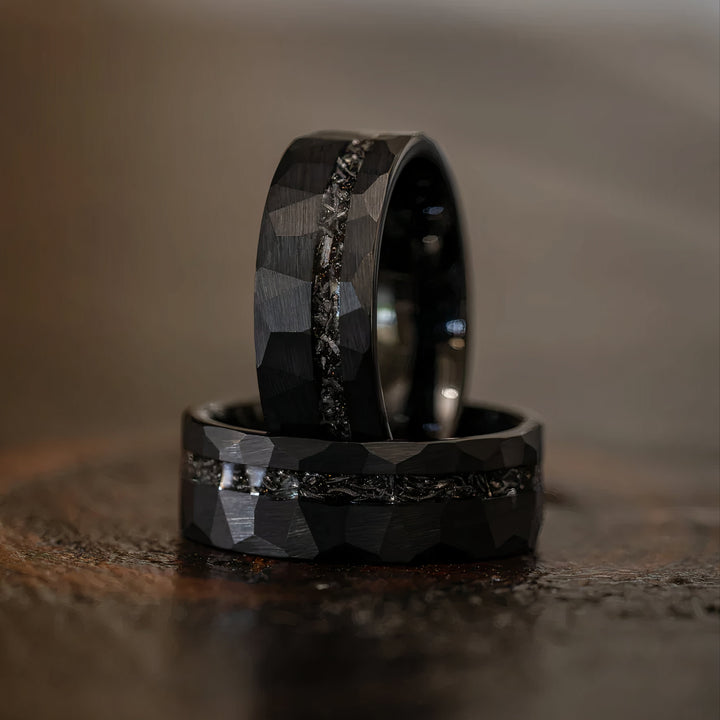 Handcrafted men's black hammered ring with meteorite inlay showcasing rugged style and cosmic elegance