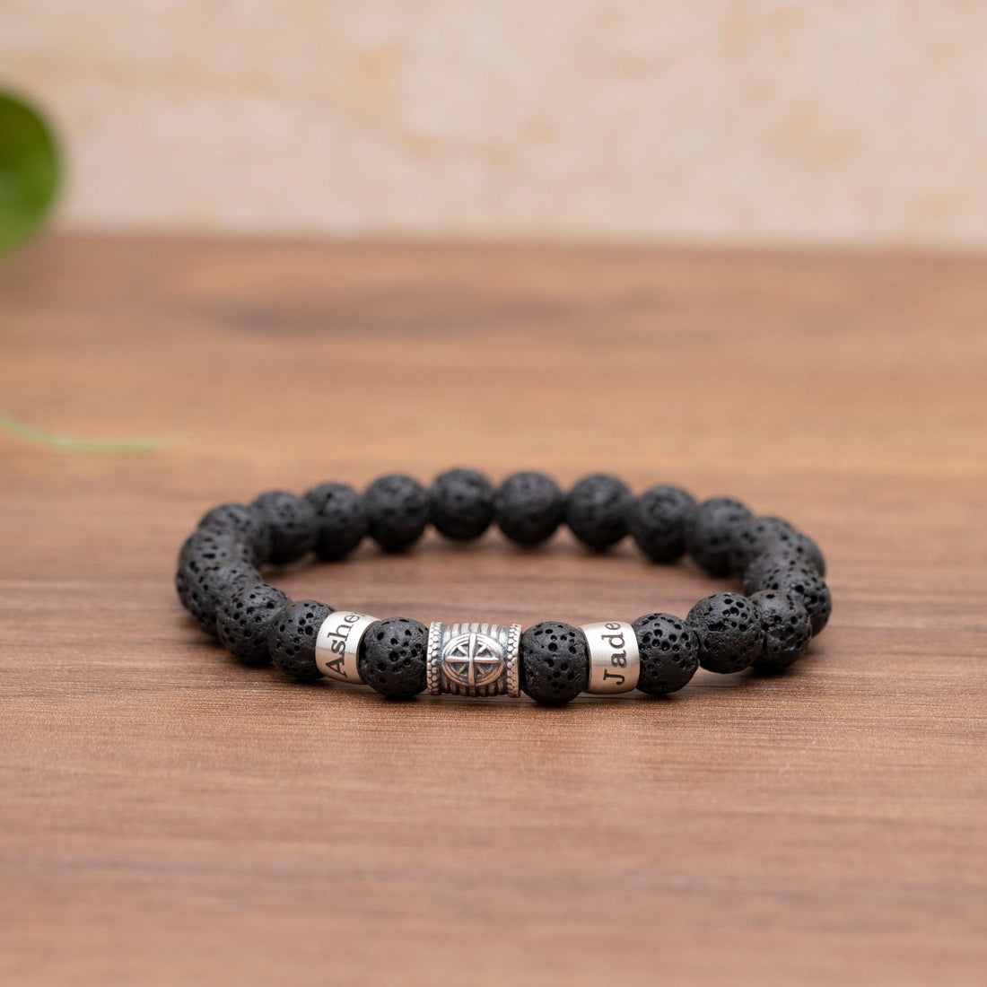 Customizable men's lava stone bracelet with a compass design, signifying the enduring guidance of family bonds, perfect for celebrating love on Valentine's Day